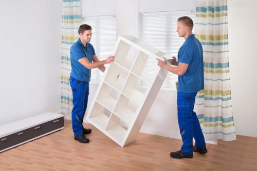 Professional Churchend removals team loading furniture into a van
