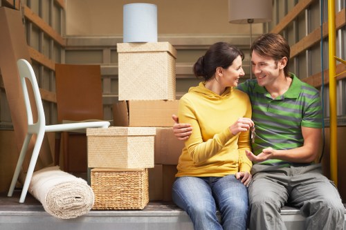 Professional movers handling furniture during a Churchend flat move